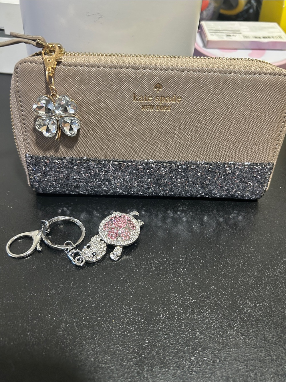 kate spade beige and silver glitter zip-around wallet